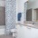 shower/tub combo in well lit bathroom
