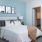carpeted bedroom with private bathroom