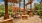 umbrella shaded tables and chairs next to water fountain